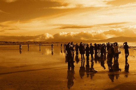 Gathering of people left behind on a shore