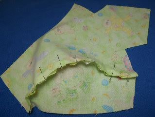 Top/tail piece of baby dew rag pinned to side piece