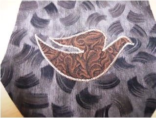 Dove applique with contrasting fabric